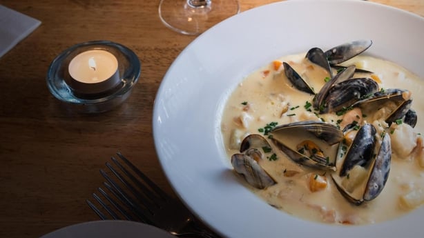 A bowl of mussels in a restaurant